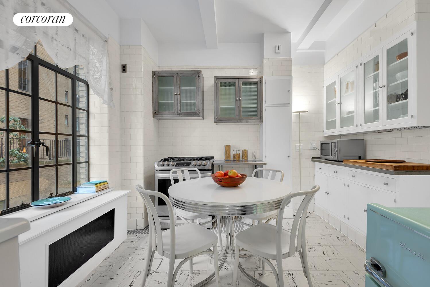 300 Central Park West, Unit 9A Manhattan, NY 10024 - Photo 7 of 15 a kitchen with stainless steel appliances granite countertop a stove a sink and a refrigerator