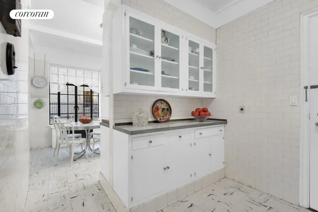 a kitchen with a sink and a stove top oven