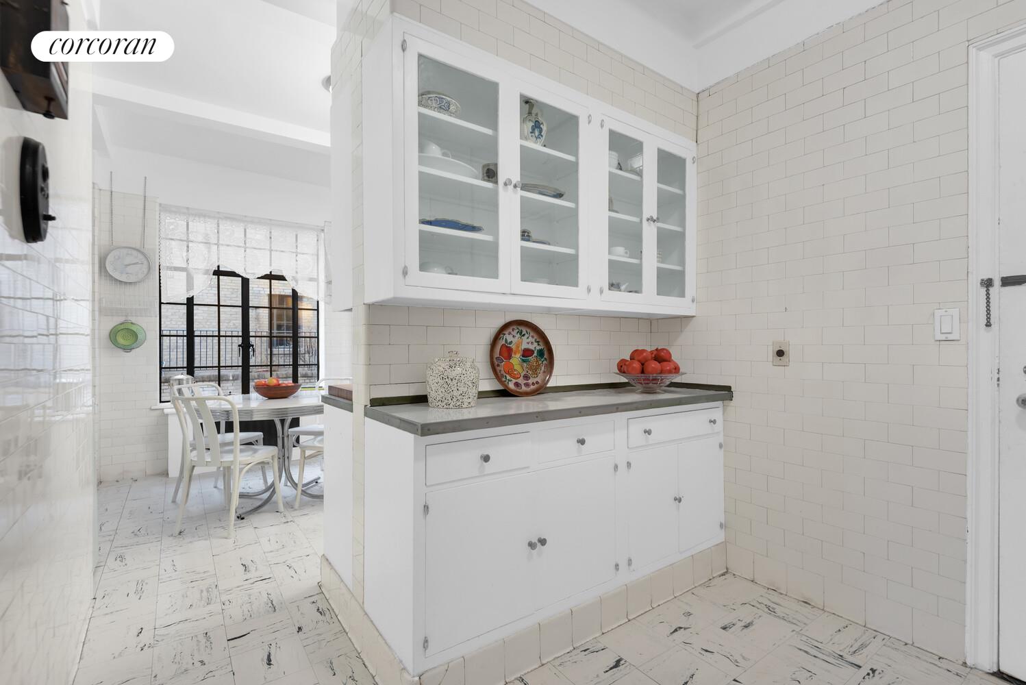 300 Central Park West, Unit 9A Manhattan, NY 10024 - Photo 8 of 15 a kitchen with a sink and a stove top oven
