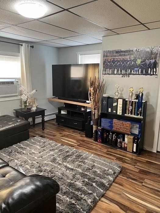 189 5th Street Fall River, MA 02721 - Photo 4 of 21 a living room with furniture and a flat screen tv