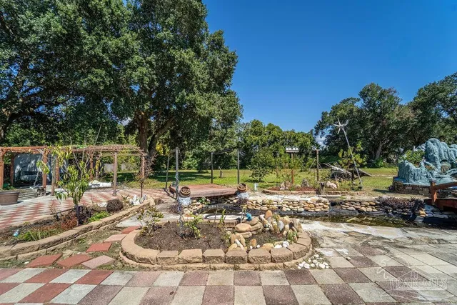 a view of a chair and tables in the patio