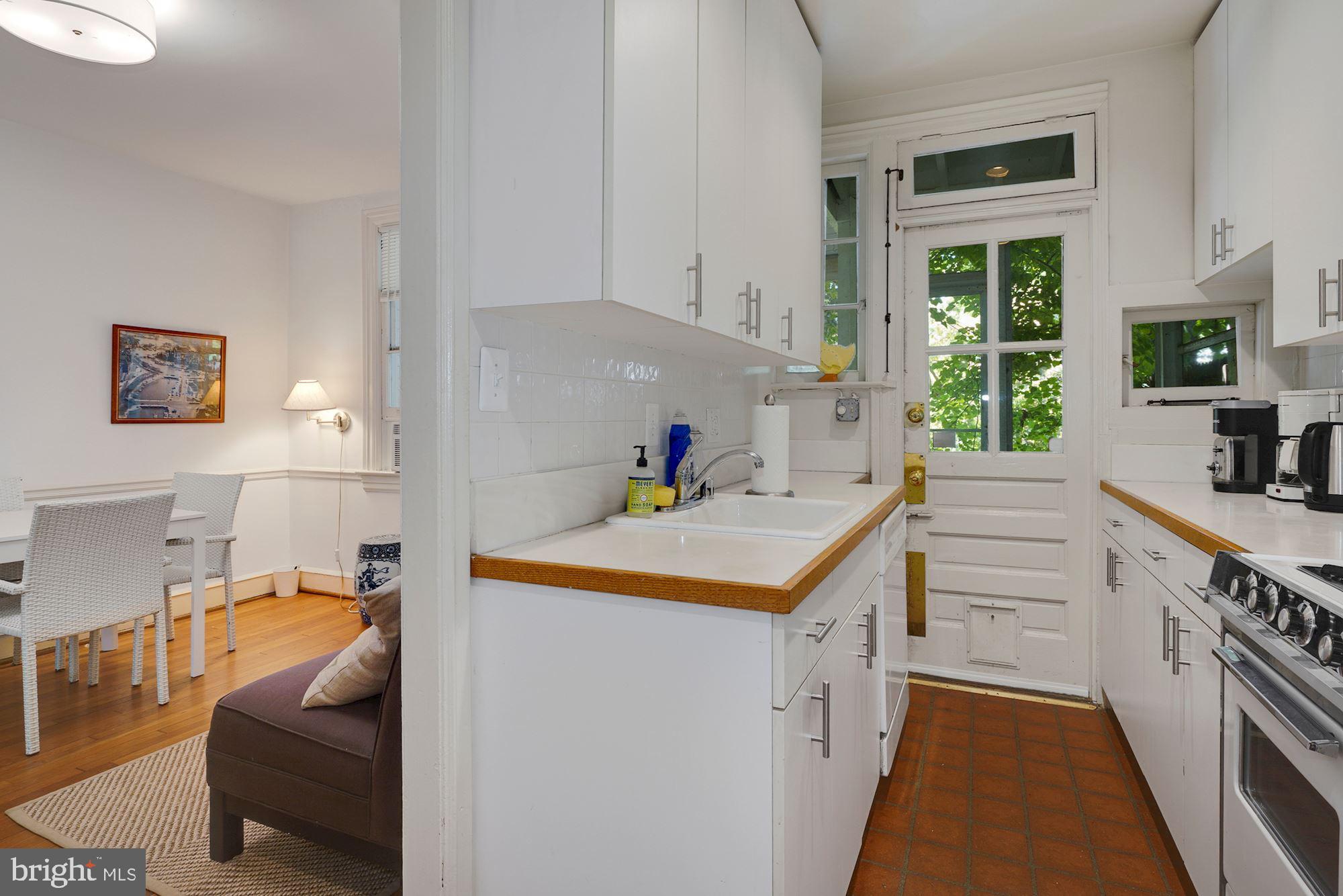 3702 R Street Northwest Washington, DC 20007 - Photo 10 of 32 Nice kitchen leading to a screen porch & backyard