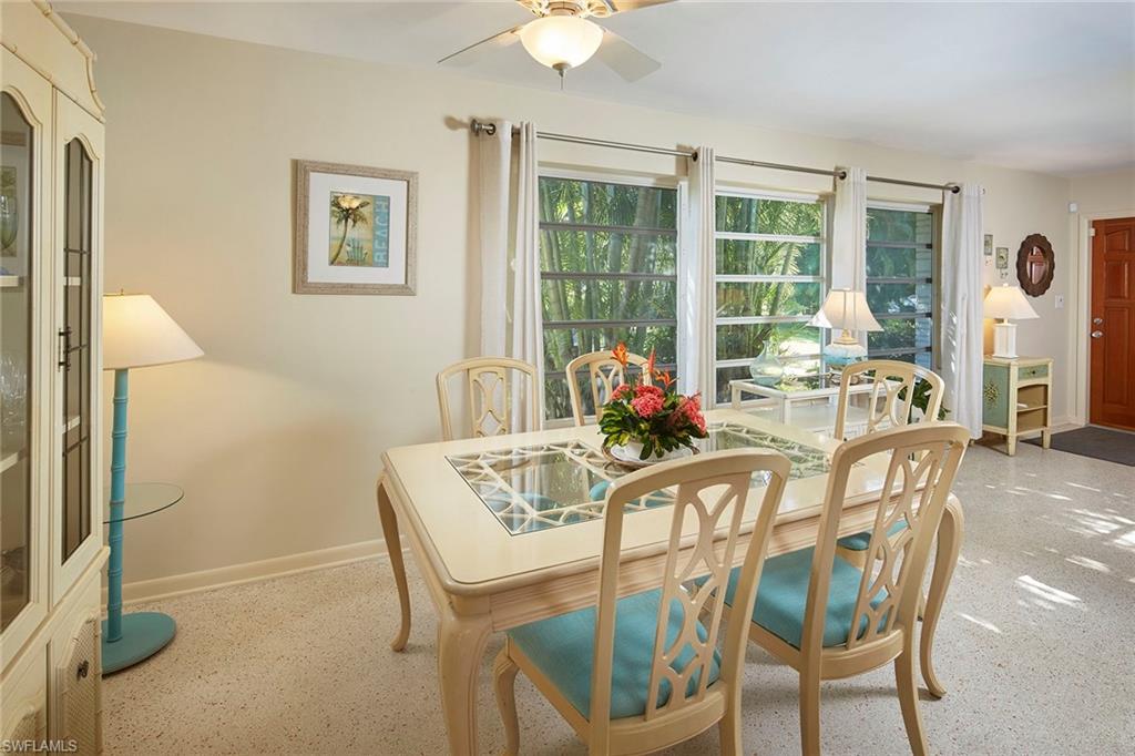 1829 Mandarin Road Naples, FL 34102 - Photo 6 of 14 a dining room with furniture and window