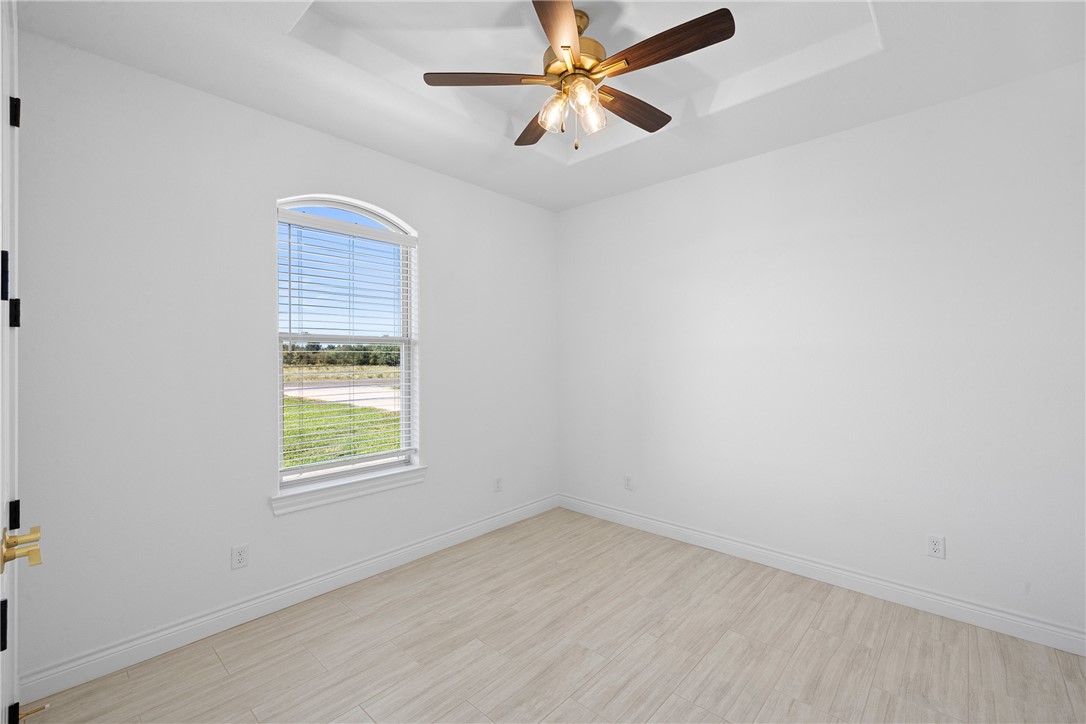 6524 Agave Court Bryan, TX 77808 - Photo 25 of 43 an empty room with a window and a fan