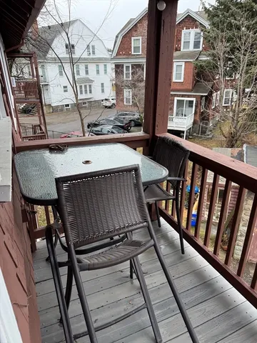 a balcony view with a sitting space