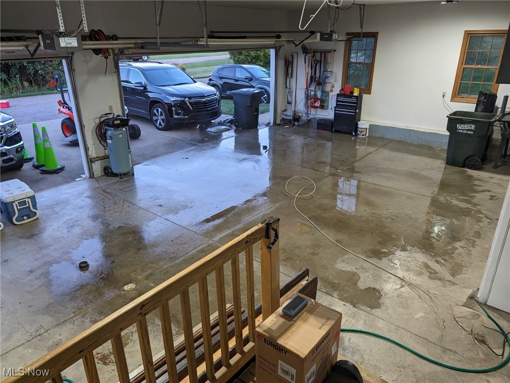2291 Armstrong Road Wooster, OH 44691 - Photo 22 of 23 Garage featuring space for 3 cars and a garage door opener