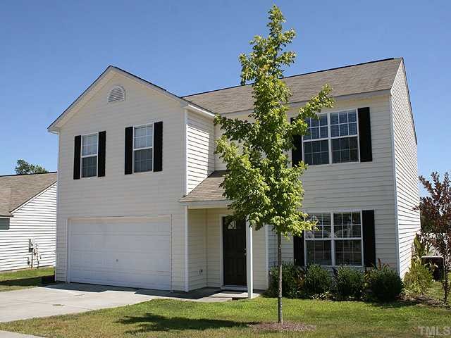 4102 Springfield Creek Drive Raleigh, NC 27616 - Photo 1 of 10 a front view of a house with a yard