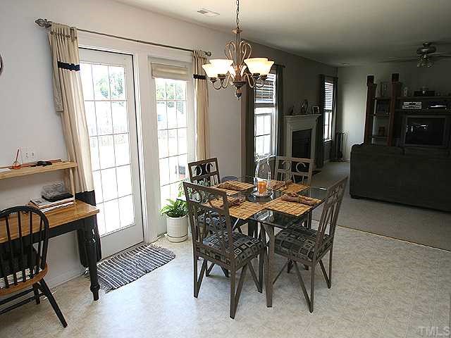 4102 Springfield Creek Drive Raleigh, NC 27616 - Photo 4 of 10 a view of a dining room with furniture window and outside view