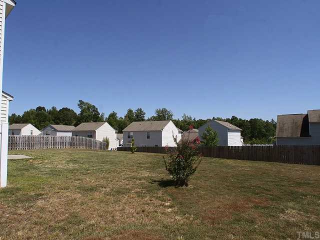 4102 Springfield Creek Drive Raleigh, NC 27616 - Photo 10 of 10 a view of a house with a yard