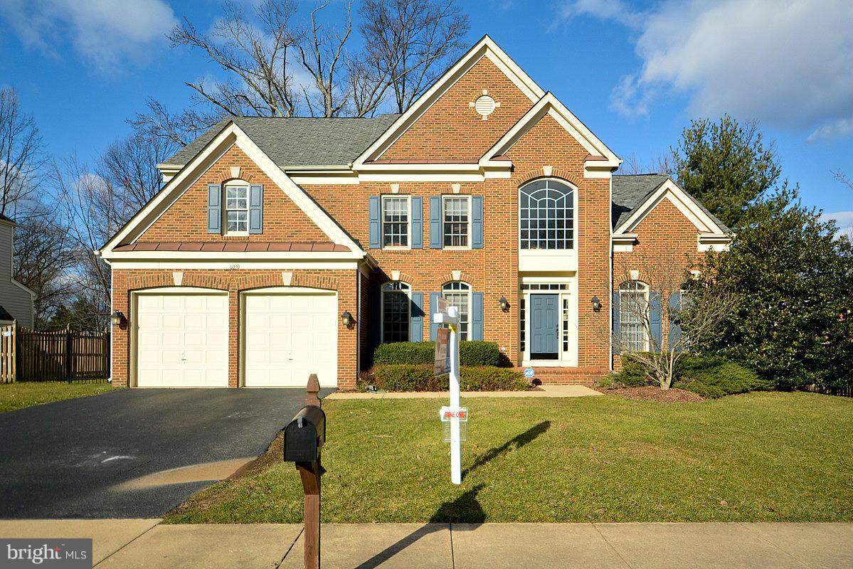 6030 Sumner Road Alexandria, VA 22310 - Photo 1 of 6 a front view of a house with garden