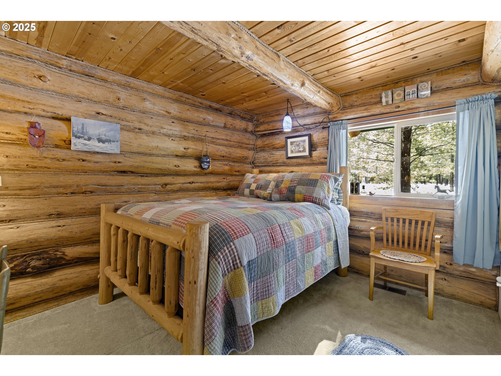 140643 Kamloop Lane Gilchrist, OR 97737 - Photo 19 of 36 a bedroom with a bed and a window