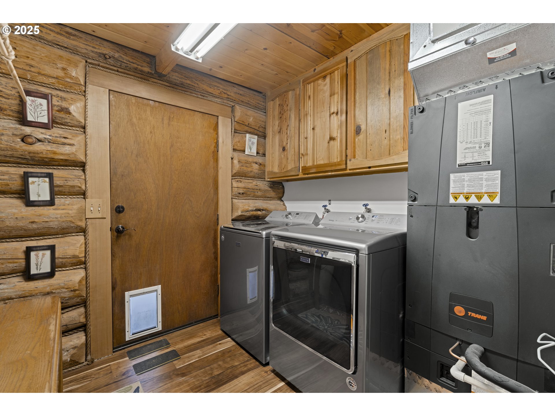 140643 Kamloop Lane Gilchrist, OR 97737 - Photo 20 of 36 a kitchen with stainless steel appliances granite countertop a refrigerator a stove and a sink with wooden cabinets