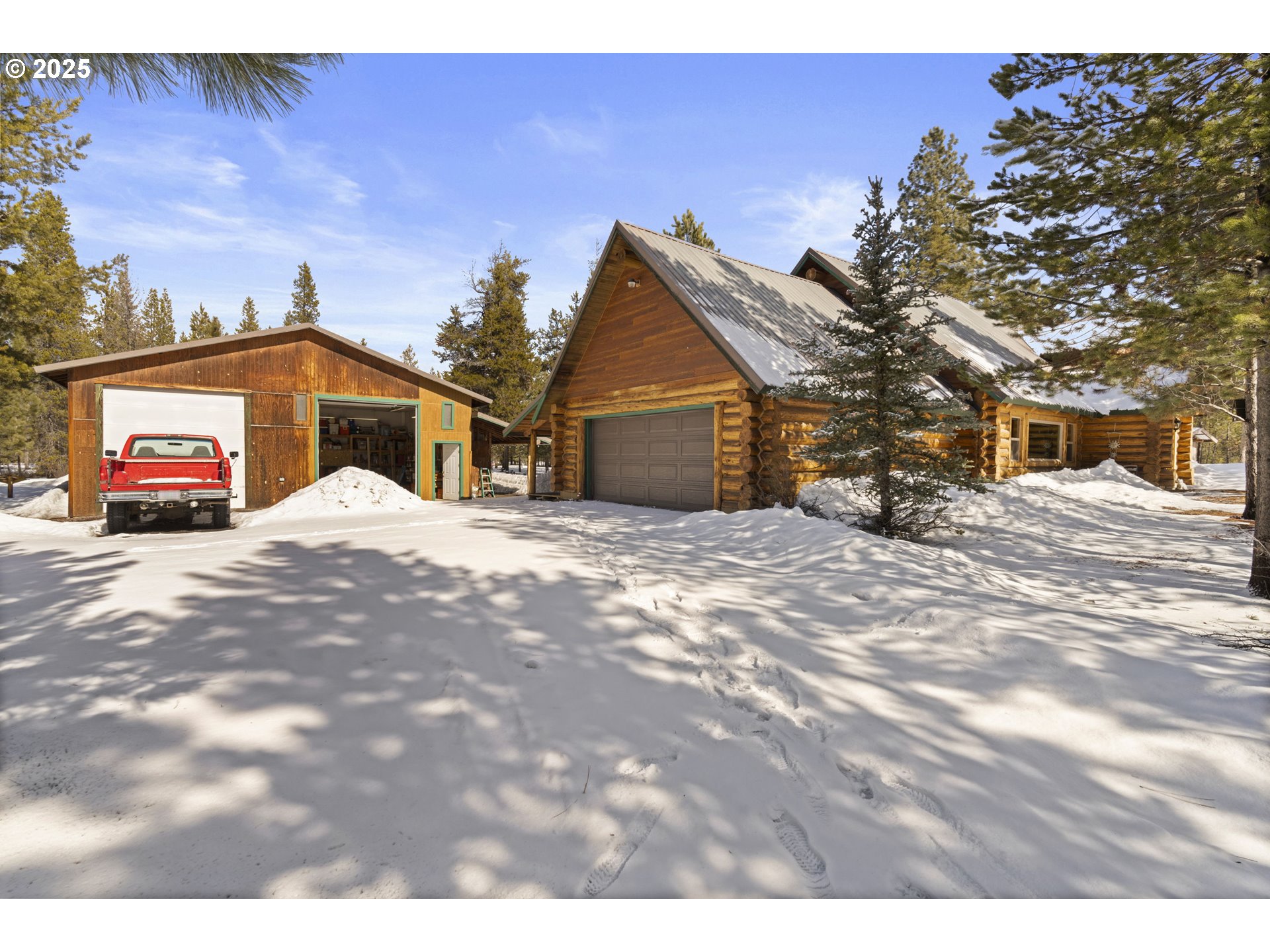 140643 Kamloop Lane Gilchrist, OR 97737 - Photo 22 of 36 a view of a house with a snow in the yard