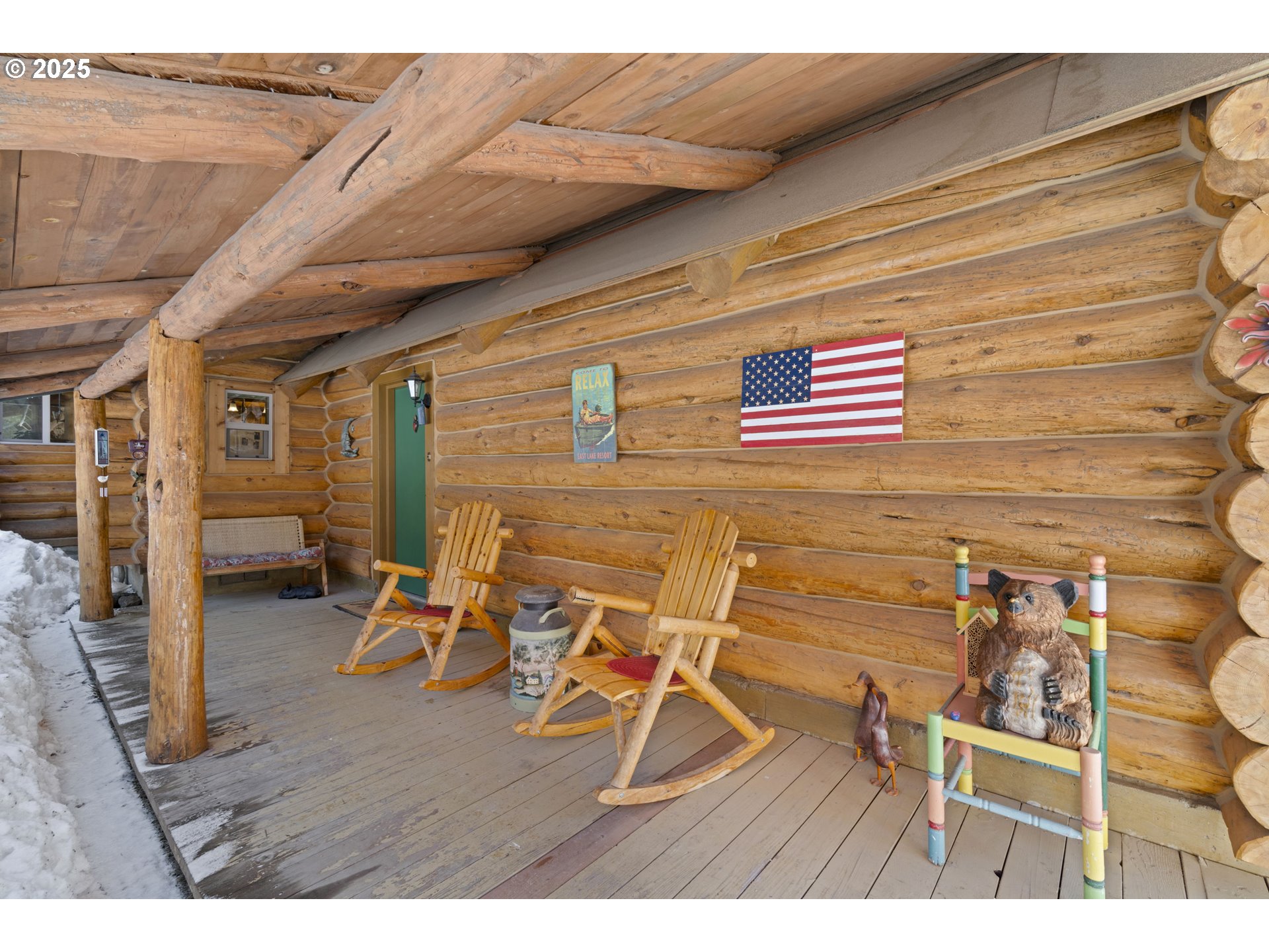 140643 Kamloop Lane Gilchrist, OR 97737 - Photo 23 of 36 a view of a patio with table and chairs with wooden floor