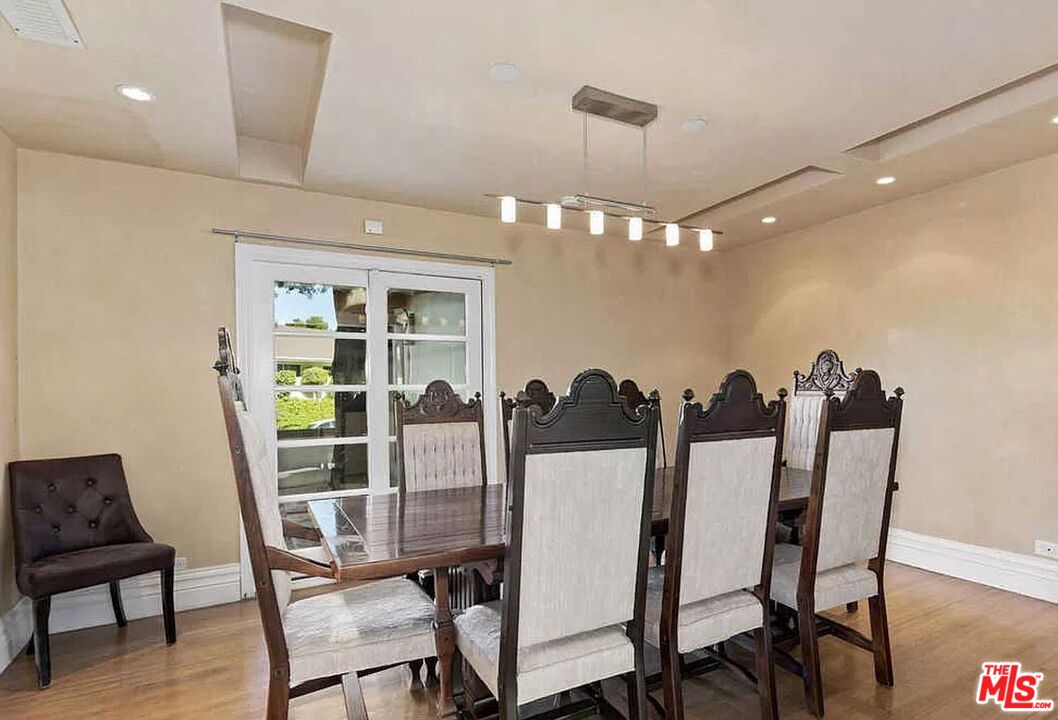 3441 White Rose Way Encino, CA 91436 - Photo 11 of 22 a view of a dining room with furniture and wooden floor