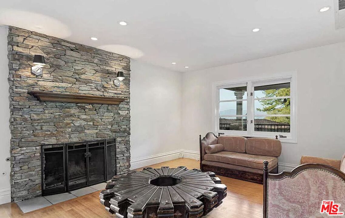 3441 White Rose Way Encino, CA 91436 - Photo 20 of 22 a living room with furniture and a fireplace