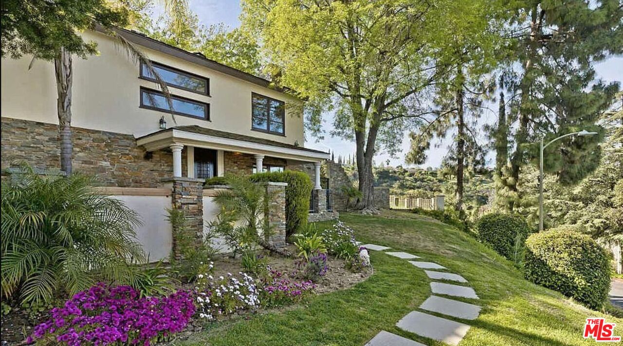 3441 White Rose Way Encino, CA 91436 - Photo 2 of 22 a front view of a house with garden