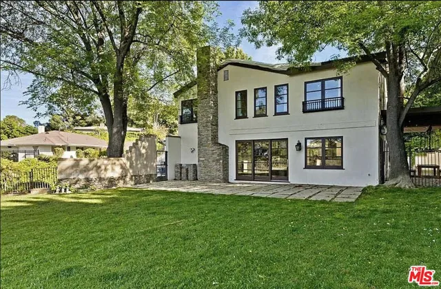 a view of grassy field with benches