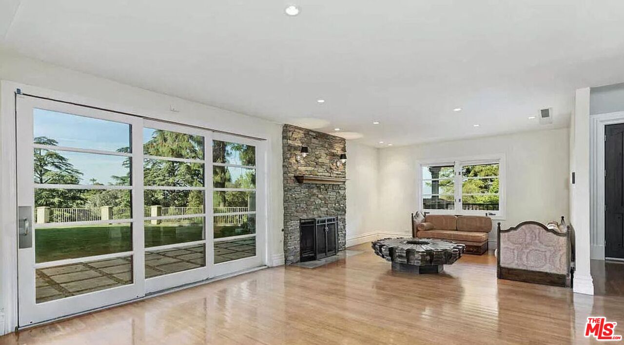 3441 White Rose Way Encino, CA 91436 - Photo 8 of 22 a living room with furniture window and wooden floor