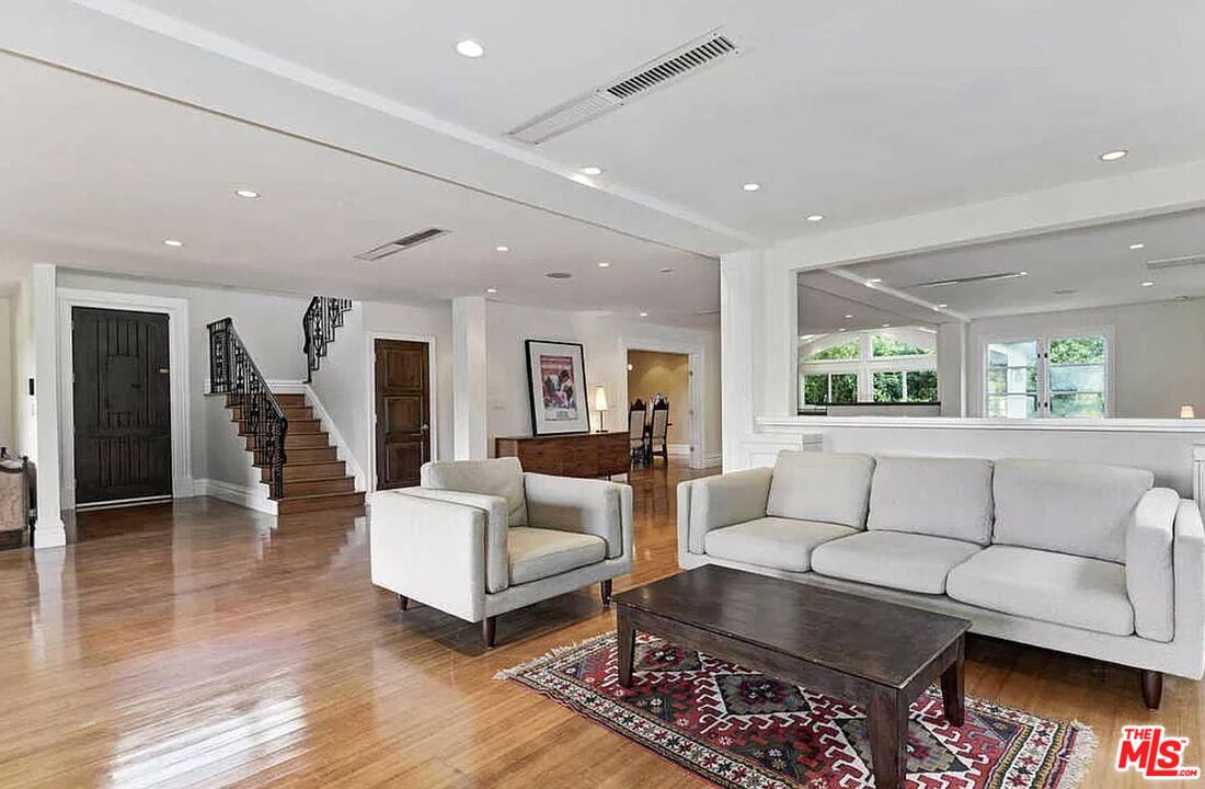 3441 White Rose Way Encino, CA 91436 - Photo 9 of 22 a living room with furniture and wooden floor