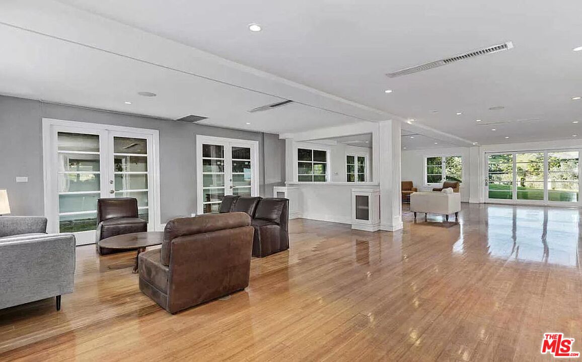 3441 White Rose Way Encino, CA 91436 - Photo 10 of 22 a living room with furniture and a wooden floor