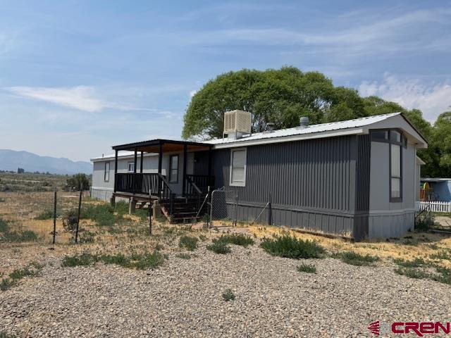 28260 Highway 160, Unit 81 Cortez, CO 81321 - Photo 11 of 20 a backyard of a house with lots of green space