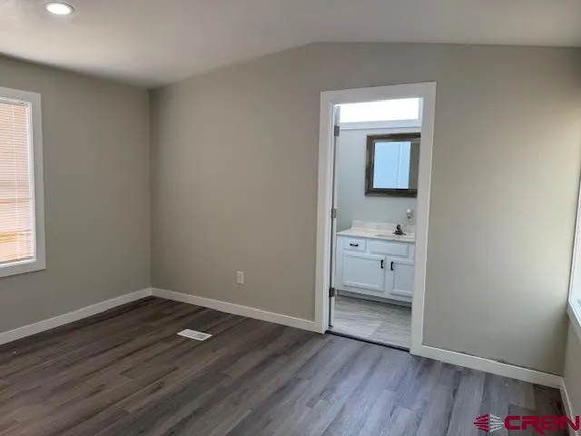 wooden floor in an empty room and a window
