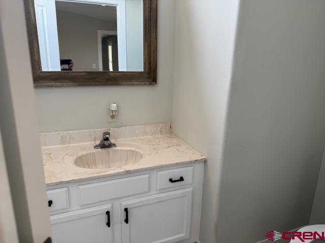 28260 Highway 160, Unit 81 Cortez, CO 81321 - Photo 13 of 20 a bathroom with a sink and a mirror