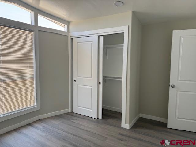 28260 Highway 160, Unit 81 Cortez, CO 81321 - Photo 20 of 20 a view of empty room with wooden floor