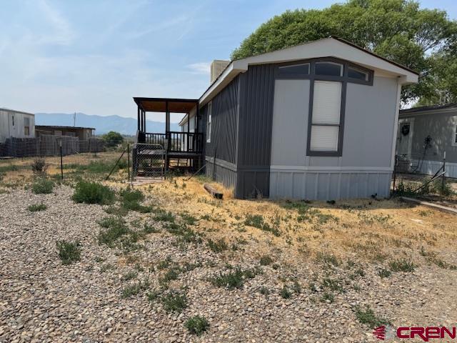 28260 Highway 160, Unit 81 Cortez, CO 81321 - Photo 2 of 20 a wooden house with a outdoor space