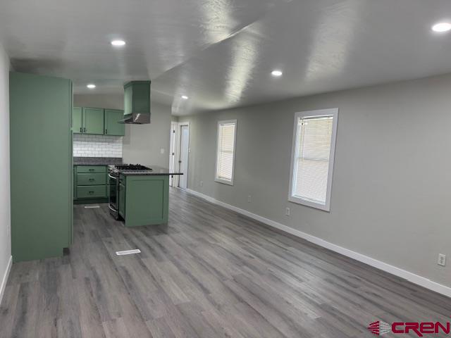 28260 Highway 160, Unit 81 Cortez, CO 81321 - Photo 6 of 20 a kitchen with stainless steel appliances granite countertop a sink a stove and wooden floor