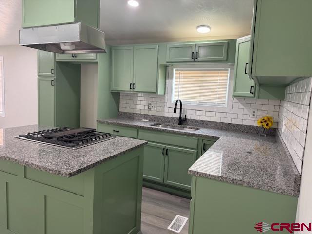 28260 Highway 160, Unit 81 Cortez, CO 81321 - Photo 9 of 20 a kitchen with a sink stove and cabinets