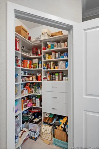 a bedroom with bed and a flat tv screen