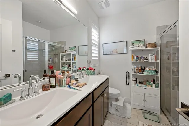 a kitchen with a refrigerator and cabinets