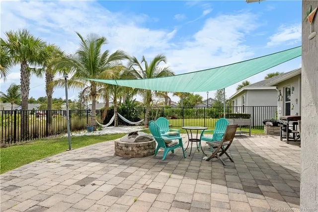 a kitchen with refrigerator and window