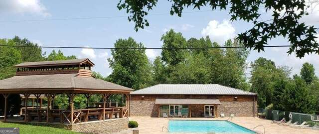 137 Abe Court Ranger, GA 30734 - Photo 11 of 15 a backyard of a house with wooden floor and palm tree