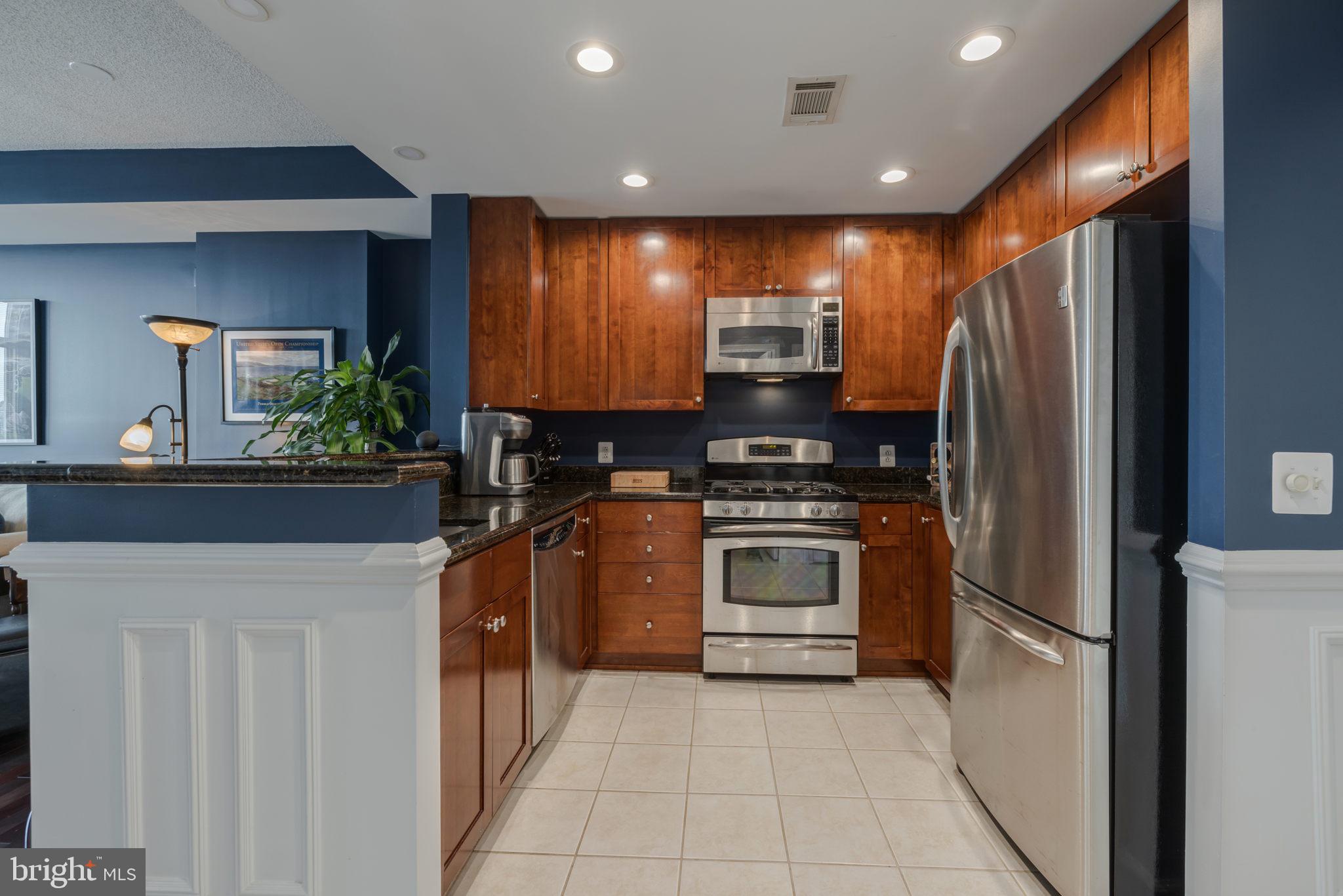 3600 South Glebe Road, Unit 409W Arlington, VA 22202 - Photo 4 of 34 a kitchen with stainless steel appliances a refrigerator sink and stove
