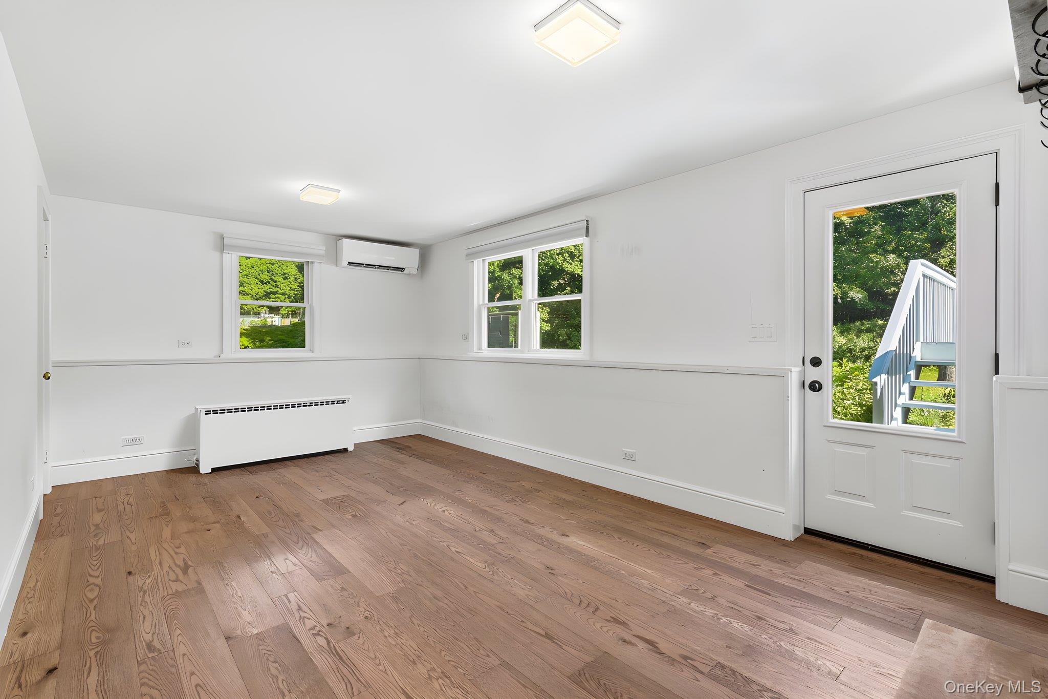 119 Mustato Road Katonah, NY 10536 - Photo 11 of 31 Lower level office/den door to back yard, door to garage and access to basement