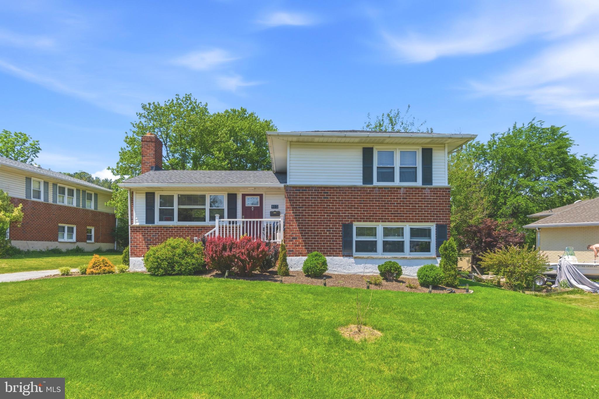 912 Shelley Road Towson, MD 21286 - Photo 1 of 27 a front view of a house with a garden and plants