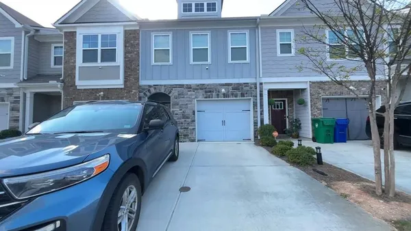 a front view of a house with parking space