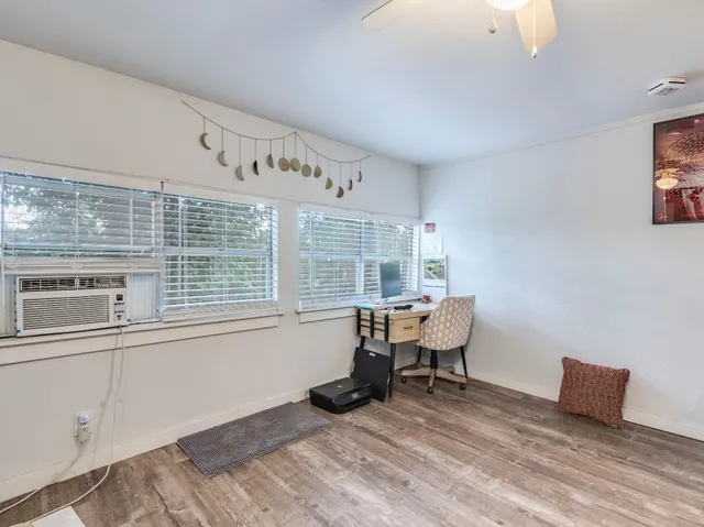 a view of a living room and dining room