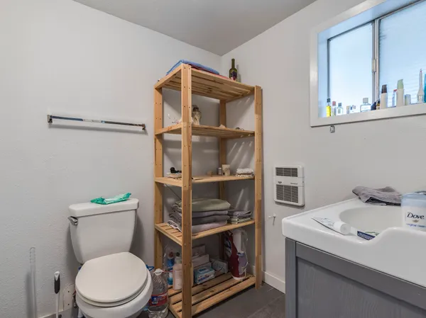 a bathroom with a toilet and a sink