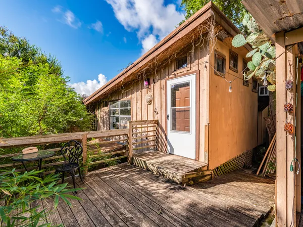 a backyard of a house with seating space