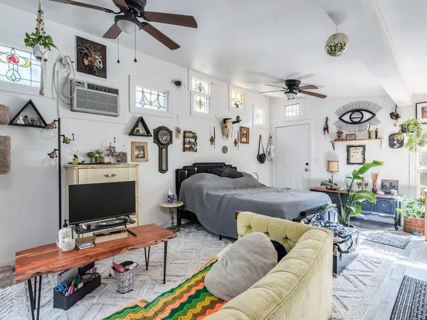 a living room with furniture and a flat screen tv
