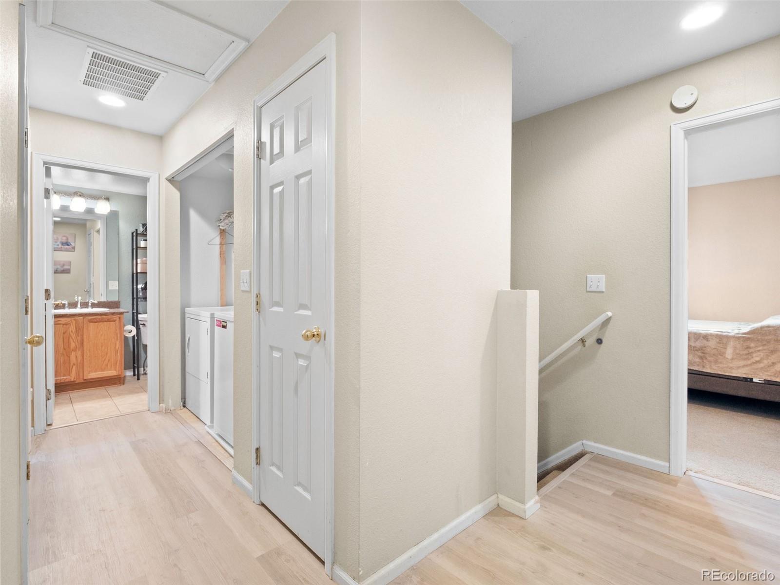 9323 Welby Road Denver, CO 80229 - Photo 17 of 40 a view of a bathroom from the hallway