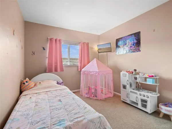 a bedroom with a bed and a closet