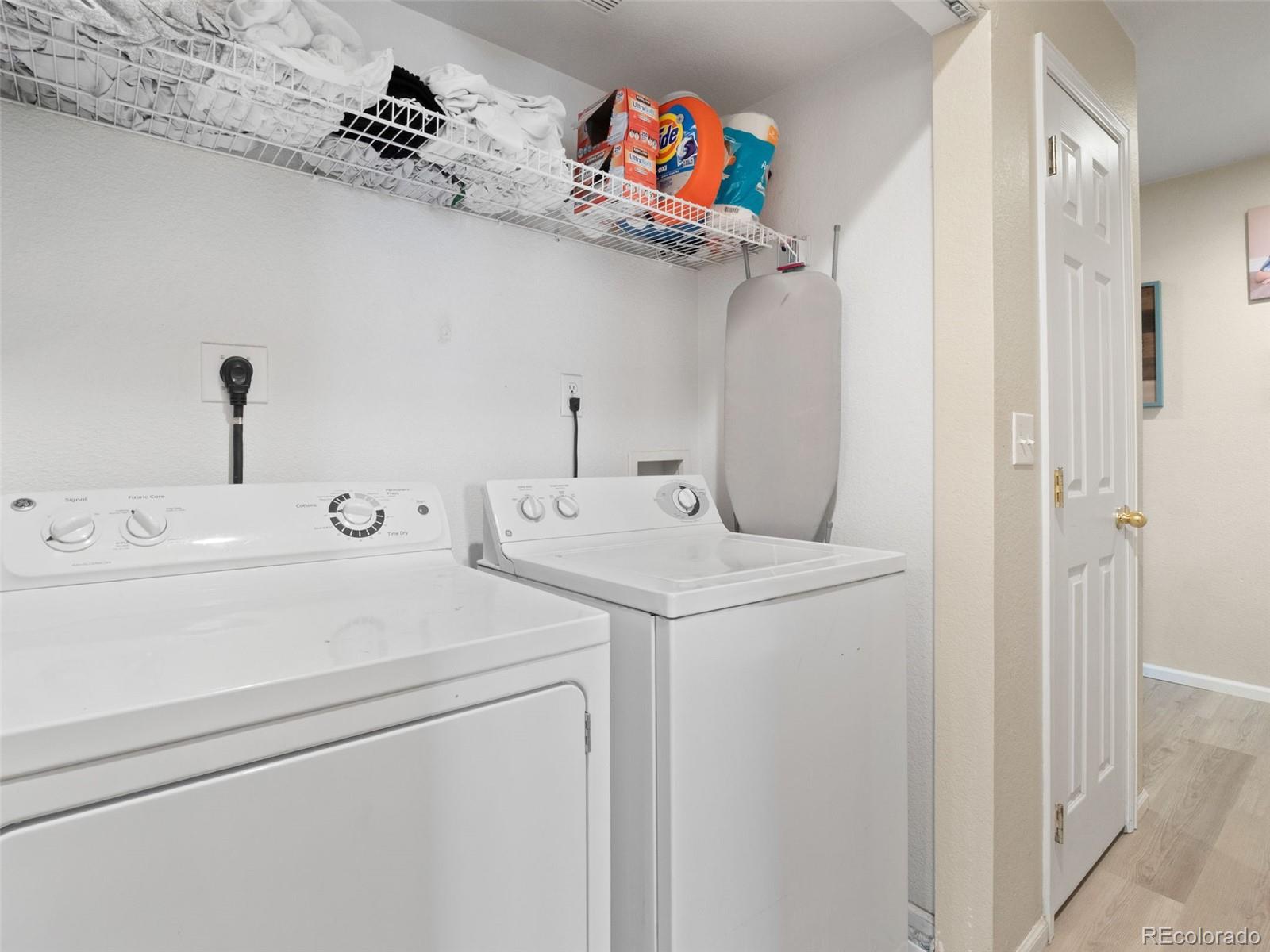 9323 Welby Road Denver, CO 80229 - Photo 25 of 40 a utility room with dryer and washer
