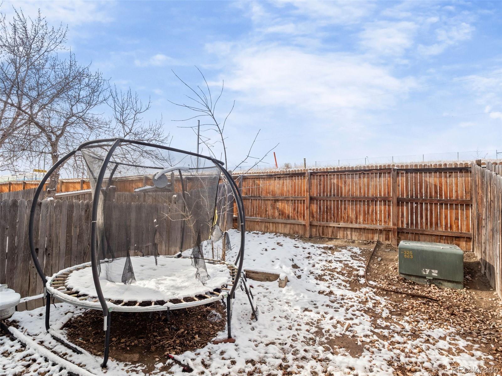 9323 Welby Road Denver, CO 80229 - Photo 26 of 40 a view of a swimming pool with a patio