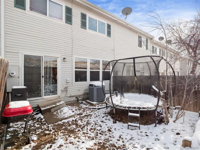 a view of a backyard with sitting area