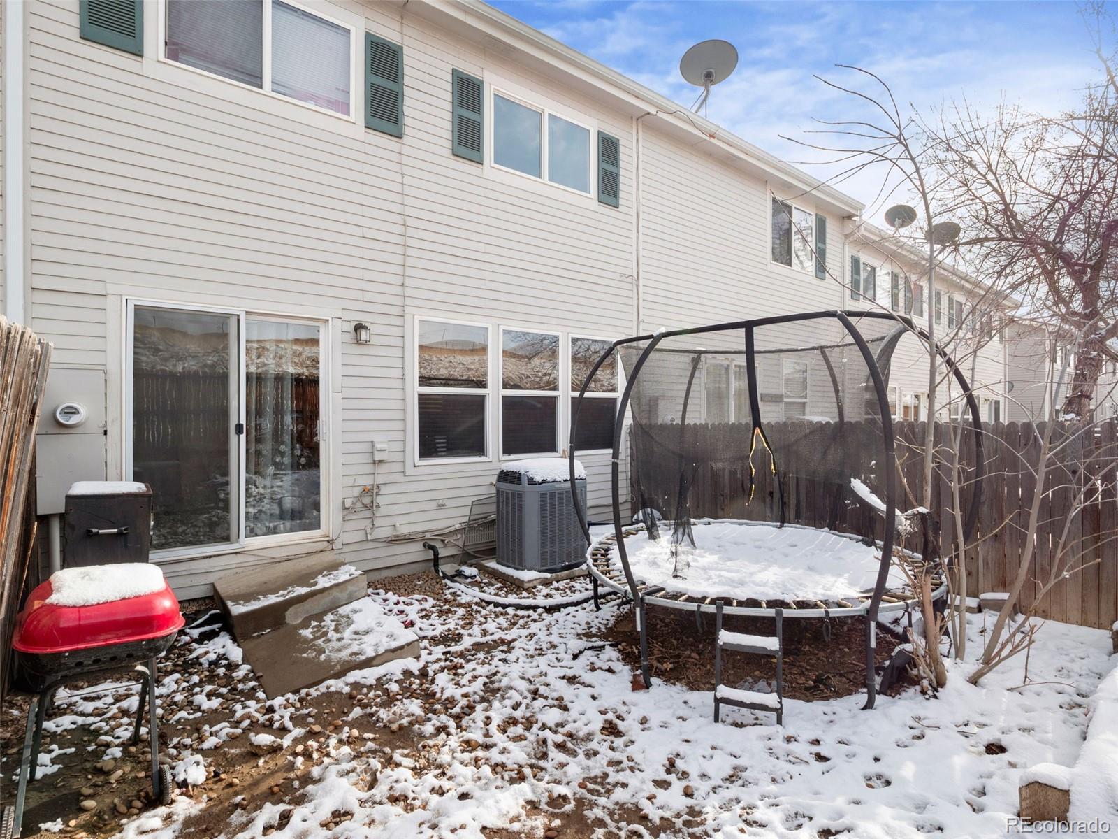 9323 Welby Road Denver, CO 80229 - Photo 27 of 40 a view of a backyard with sitting area